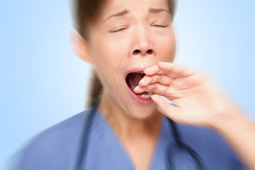 Tired nurse yawn at work