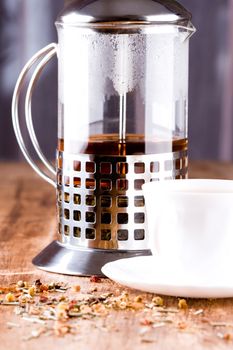 french press with herbal tea