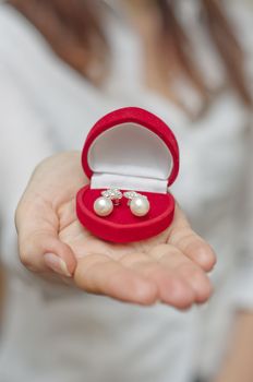 Pearl earring in red box