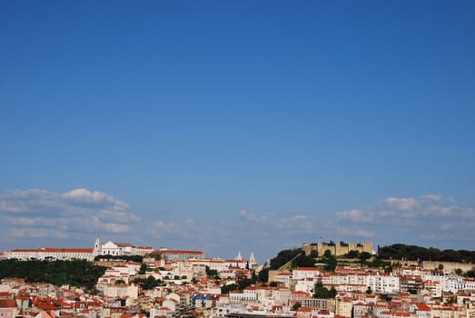 beautiful cityscape of Lisbon with Gra�a Church and Sao Jorge Castle, Portugal (from left to right)