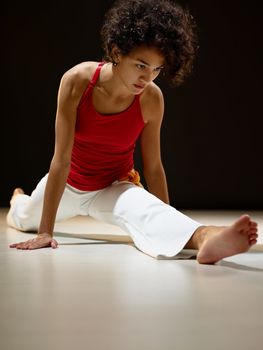 hispanic woman doing leg splits