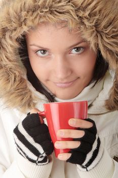 Winter girl with hot cup 
