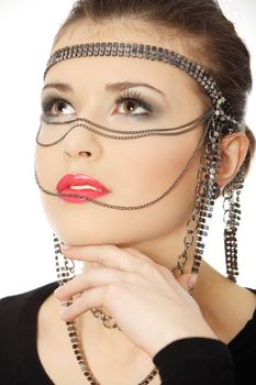 Beutiful brunette with jewelery on her face