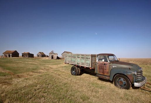 Antique Chevy farm truck in old farmyard