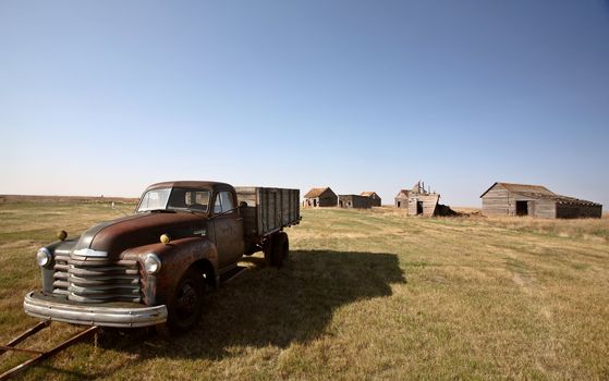 Antique Chevy farm truck in old farmyard