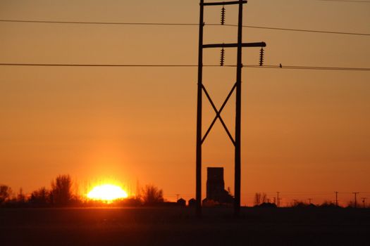 Sun rising behind Benson Saskatchewan