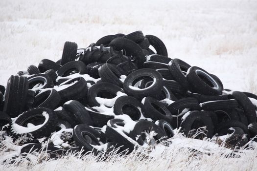 Pile of used tires in winter