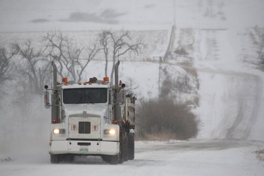 Trucker hauling gravel in winter