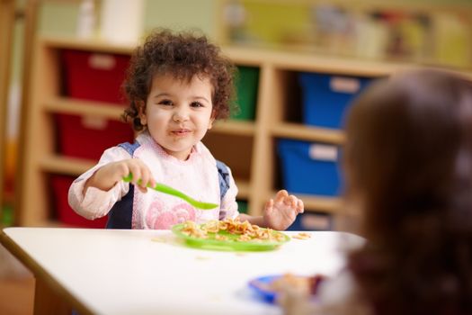 Children eating lunch in kindergarten
