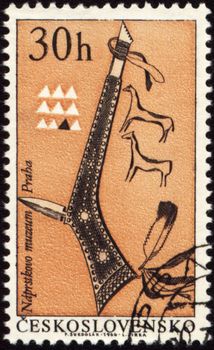 Tomahawk of American indian on post stamp