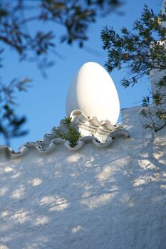 white egg on tile roof