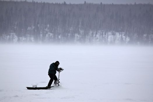 Ice fisherman on Waskesiu Lake