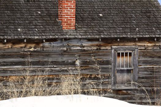 Deserted pioneer house in winter