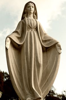 Monument Lady of Guadalupe on a cemetery