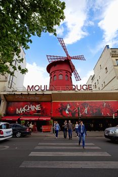 Moulin Rouge, a famous cabaret built in 1889, locating in the Paris red-light district of Pigalle.