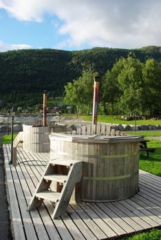 Norwegian outdoor rustic hottubs found at fjord coast