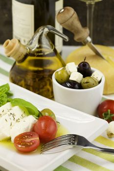 italian tomato mozarella, olives, wine and cheese