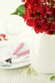place setting with hydrangea flower