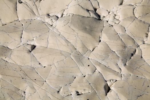 an old natural stone texture with cracks