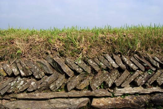 Traditional dry-stone wall in farmland
