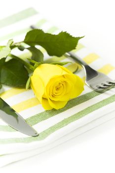Place setting with yellow rose