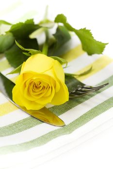 Place setting with yellow rose