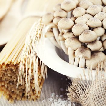 Raw Ingredients For Making Pasta (spaghetti, mushrooms)