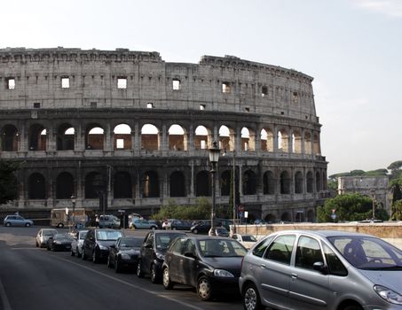 Colosseum and Parked Cars
