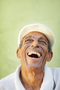 aged latino man smiling for joy