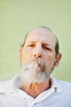 aged caucasian man smoking cigarette 