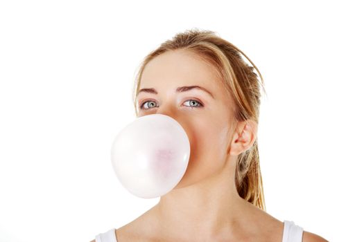 Teen woman blowing bubble gum