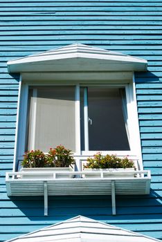 Balcony of villa with blue wooden wall