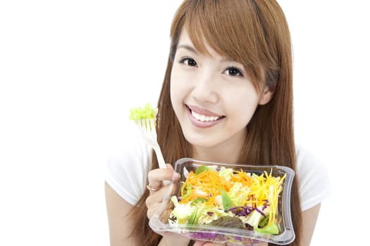 young Woman smiling and holding  vegetable and salad
