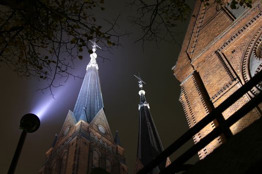 Church with twin tower by night.