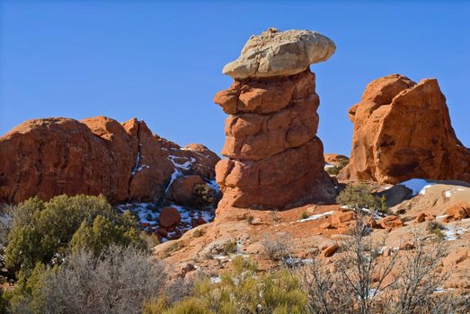 A strange caprock formation made of eroded sandstone, Arches National Park, Grand County, Utah, USA