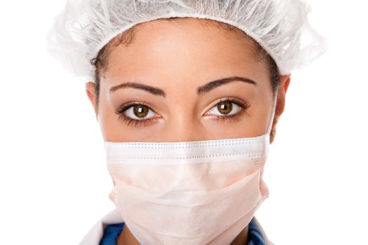 Beautiful eyes of a female doctor, nurse, or surgeon. Face with mouth and face cap for hygiene, isolated.