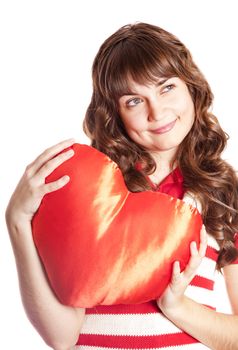 Beautiful brunette girl with toy heart. Photo for st. Valentine 