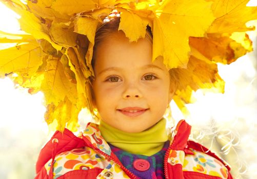 Child in autumn park. 