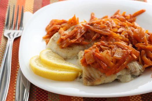 fish with fried carrot and lemon