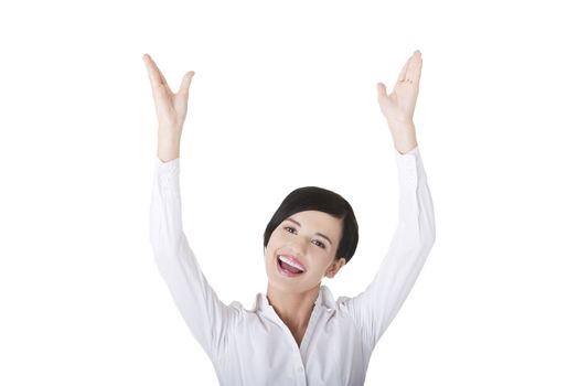 Young happy businesswoman with hands up
