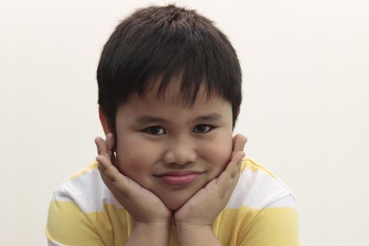happy smiling nine-year-old boy isolated on white background 
