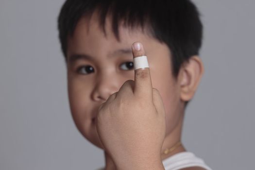 Boy with a bandaged finger