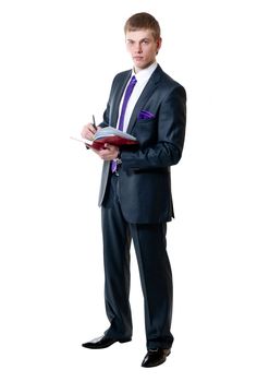 The young businessman in a suit with daily log