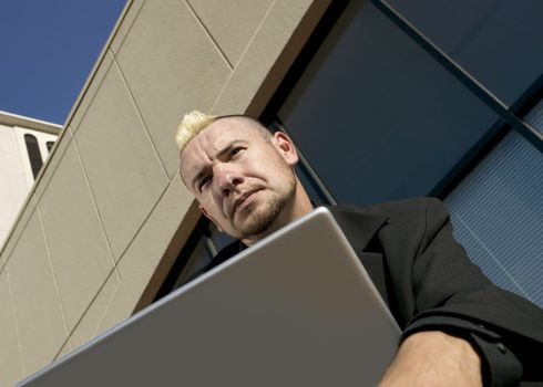 Punk Businessman with Laptop Computer