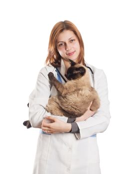 female vet with a Siamese cat in her arms