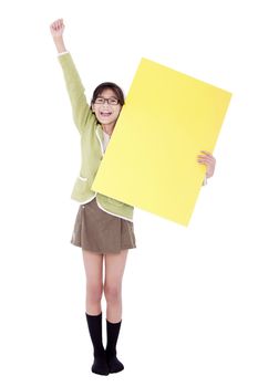 Girl in green sweater holidng blank yellow sign, arm cheering in