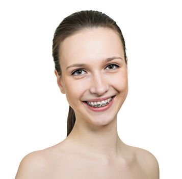 Beautiful young woman with brackets on teeth