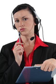 secretary wearing headset and thinking