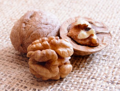 Mature walnuts on woven fabric