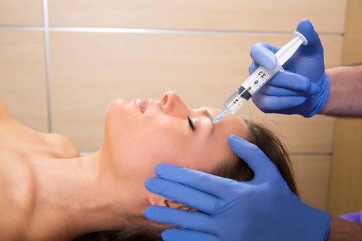 Anti aging facial mesotherapy syringe on woman face